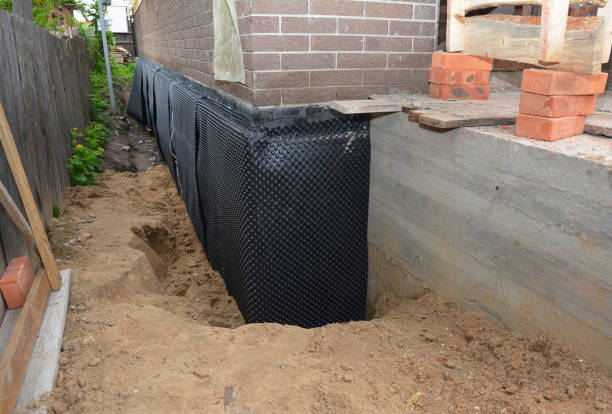 SJ Waterproofing Pros technician performing targeted Vapor Barrier Installation assessment in Lawrence, NY